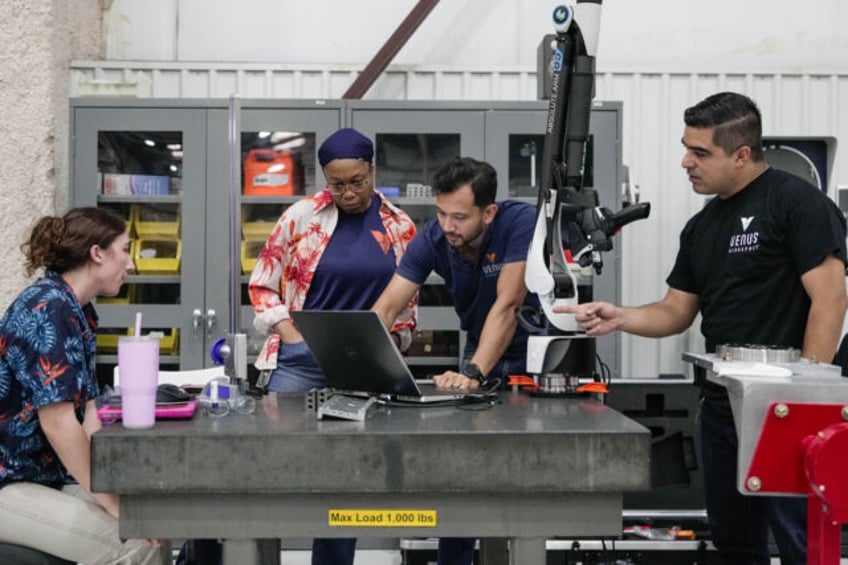 HOUSTON, TX - MAY 22: Venus Aerospace manufacturing engineers work on the Rotating Detonat