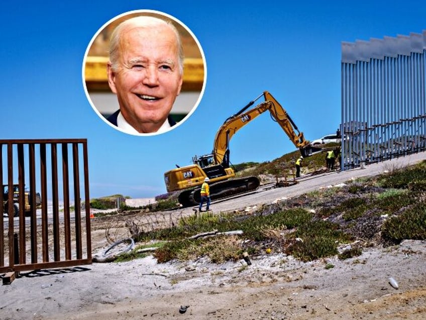 TIJUANA, MEXICO - JUNE 20: Workers construct a new wall along the southernmost part of the