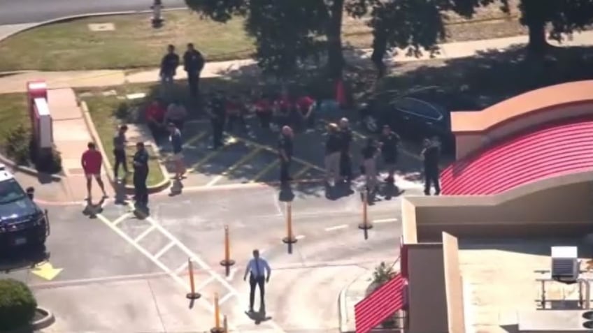 Aerial of police outside of Chick-fil-A