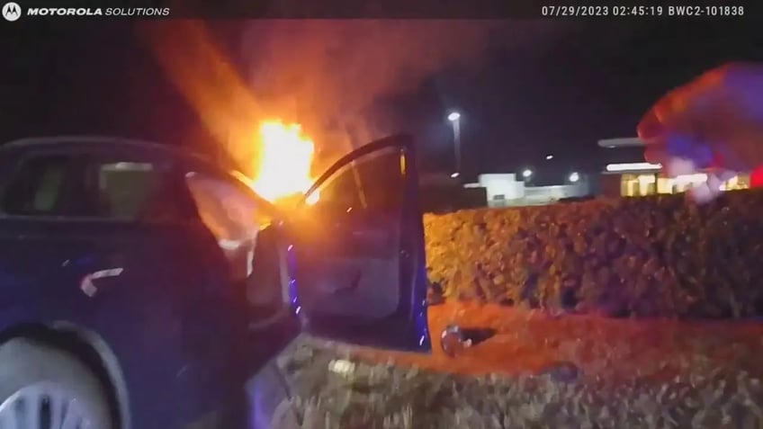 texas police pull unconscious man from burning car in heroic rescue video shows