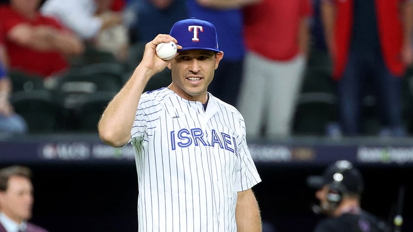 texas rangers legend ian kinsler wears team israel jersey during ceremonial first pitch in alcs