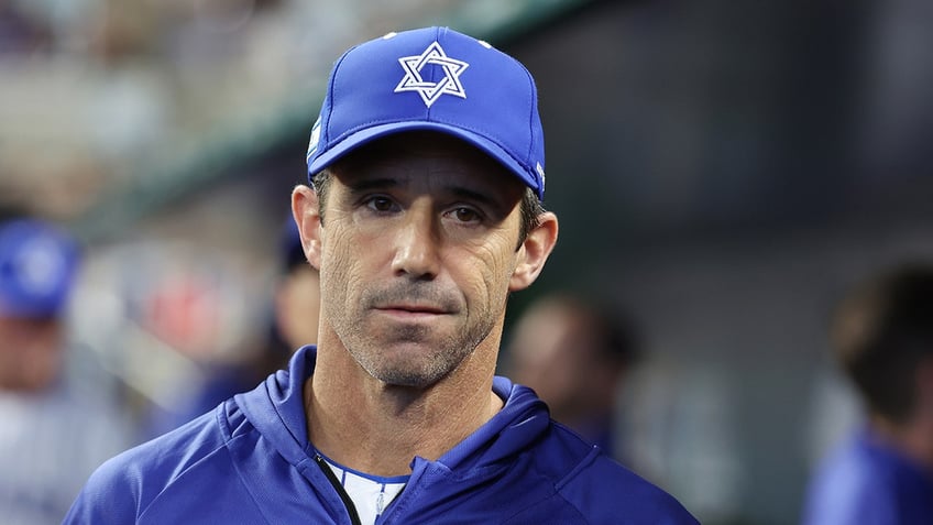 texas rangers legend ian kinsler wears team israel jersey during ceremonial first pitch in alcs