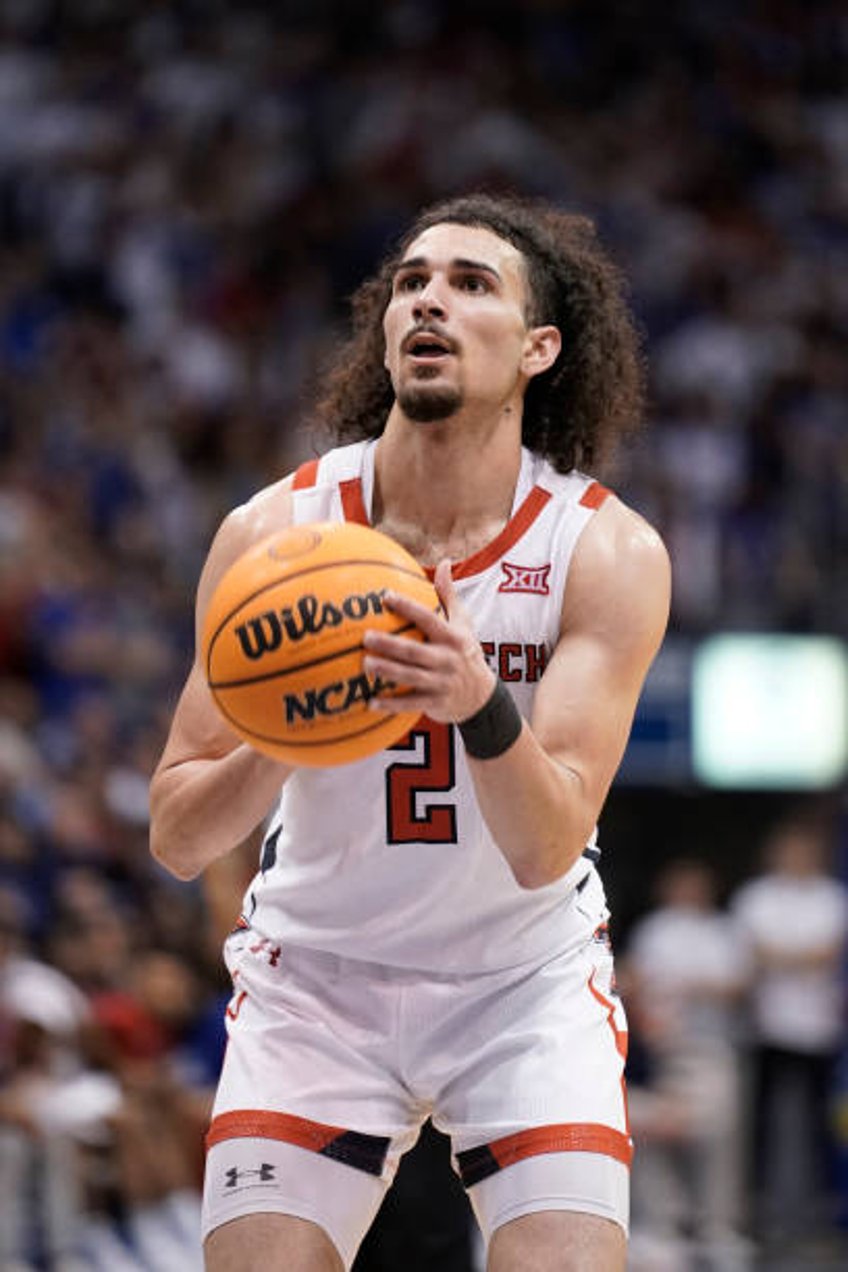 Pop Isaacs of the Texas Tech Red Raiders shoots a free throw against the Kansas Jayhawks in the second half at Allen Fieldhouse on February 28, 2023...