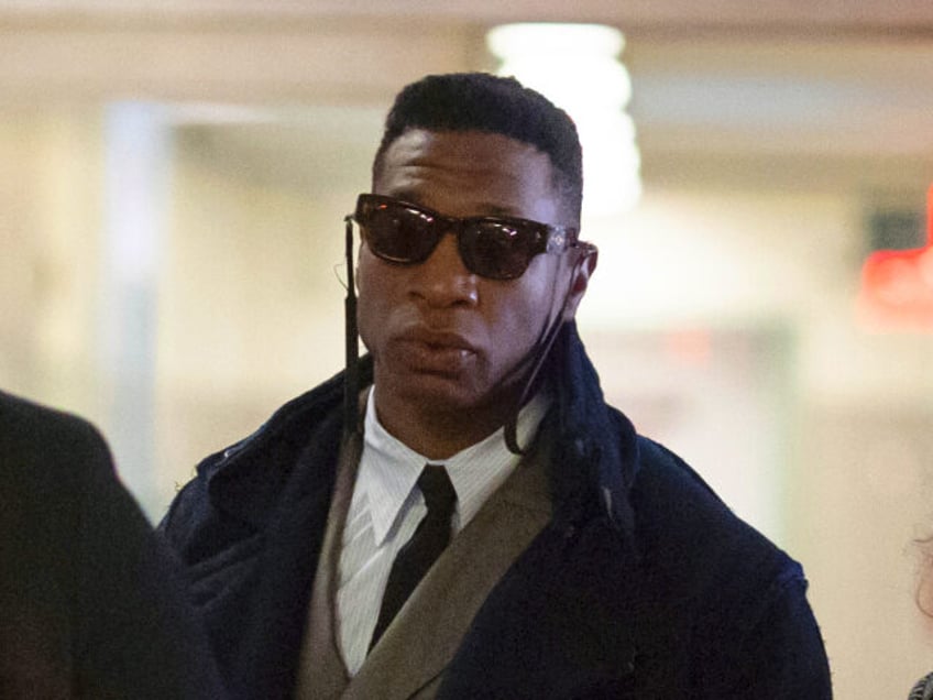 Actors Jonathan Majors, center, and Meagan Good, right, arrive at court for a jury selection on Major's domestic violence case, Wednesday, Nov. 29, 2023, in New York. (AP Photo/Yuki Iwamura)