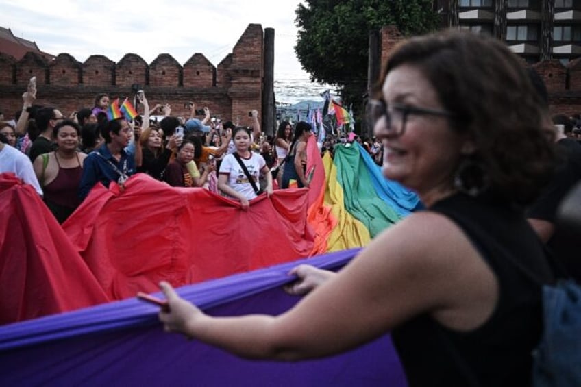 People take part in a Pride march in the Thai city of Chiang Mai last month. The country's