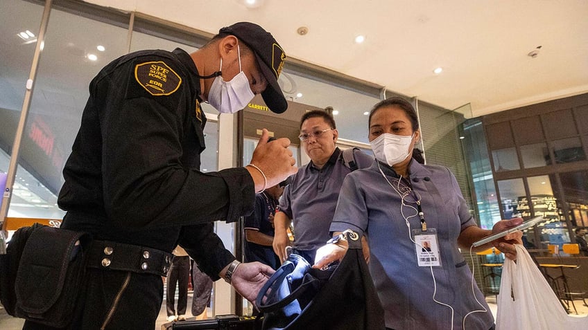 thai teenager suspected of killing 2 in mall shooting used a modified blank firing handgun police say