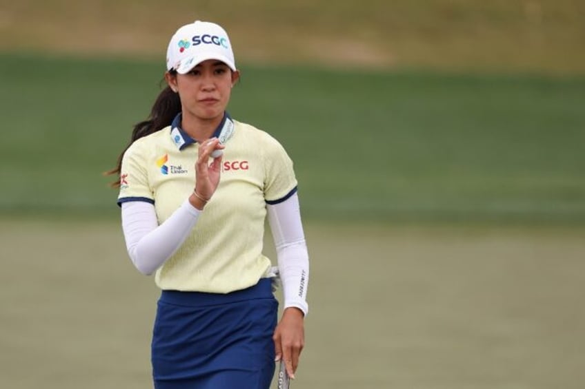 Thailand's Pajaree Anannarukarn reacts to her birdie putt at her final hole to take the fi
