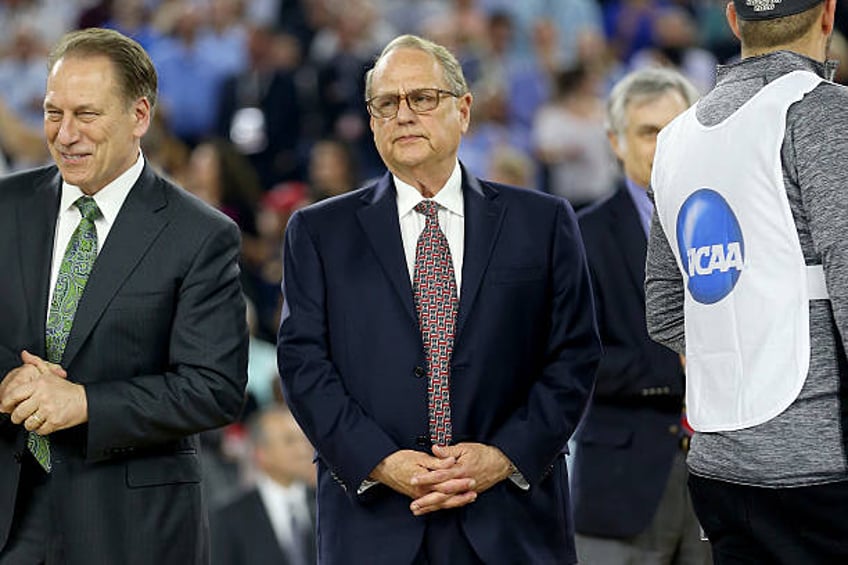 Owner Jerry Reinsdorf is on the court as the Naismith Memorial Basketball Hall Of Fame 2016 Class is announced during a break in the 2016 NCAA Men's...