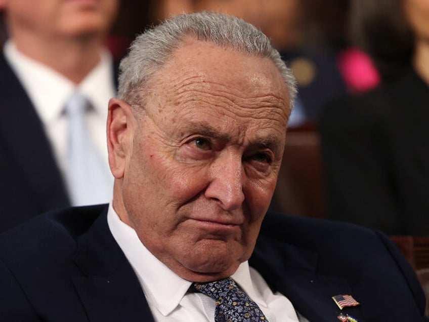 U.S. Senate Minority Leader Charles Schumer (D-NY) listens as U.S. President Donald Trump