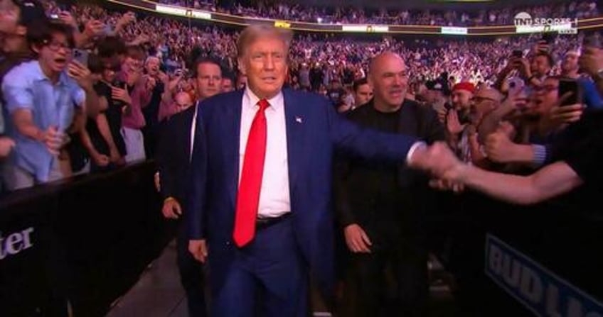 Trump enters the Prudential Arena in Newark, NJ for UFC 302 with UFC President Dana White.