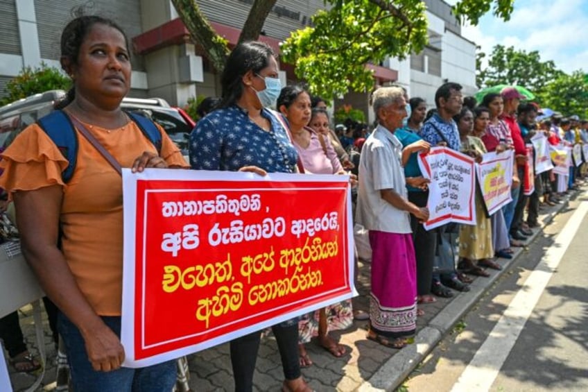 Protesters near the Russian embassy in Colombo seeking the release of Sri Lankan ex-soldi