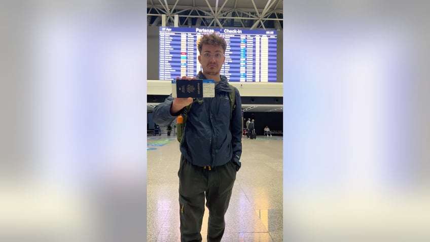 JT with his boarding pass