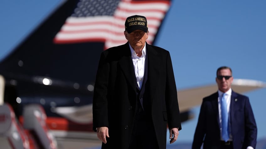 Republican presidential nominee former President Donald Trump arrives at a campaign rally at Albuquerque International Sunport, Thursday, Oct. 31, 2024, in Albuquerque, N.M. (AP Photo/Julia Demaree Nikhinson)