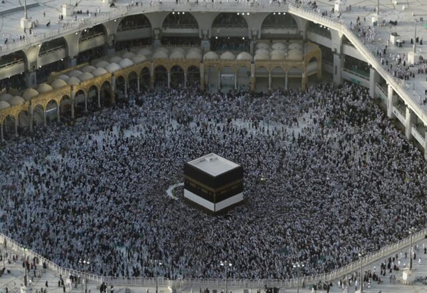 The Kaaba is a large black cubic structure at the centre of Mecca's Grand Mosque towards w