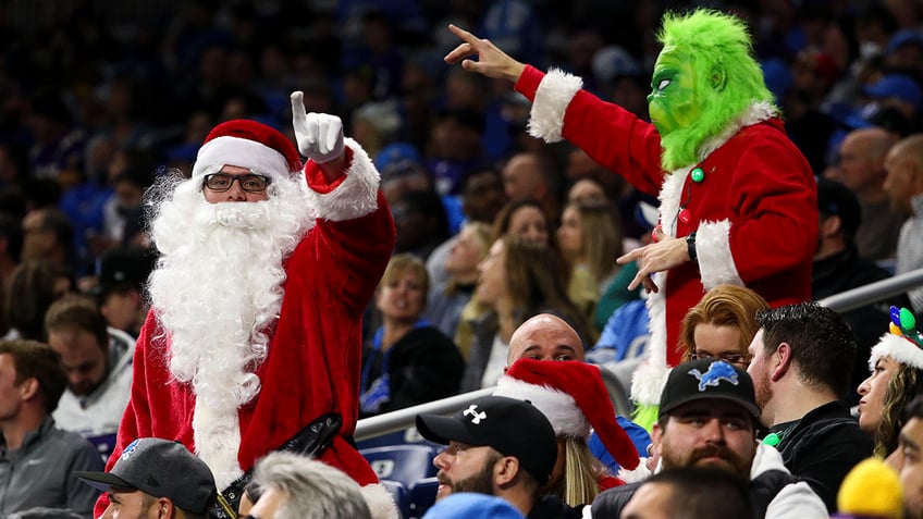 NFL fans dressed in Christmas costumes