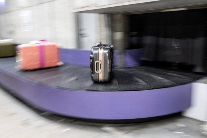 Bags arriving on a conveyer belt at Japan's Kansai International Airport