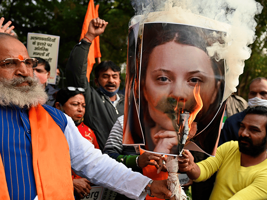 Activists of United Hindu Front (UHF) burn an effigy with a picture of Swedish climate act