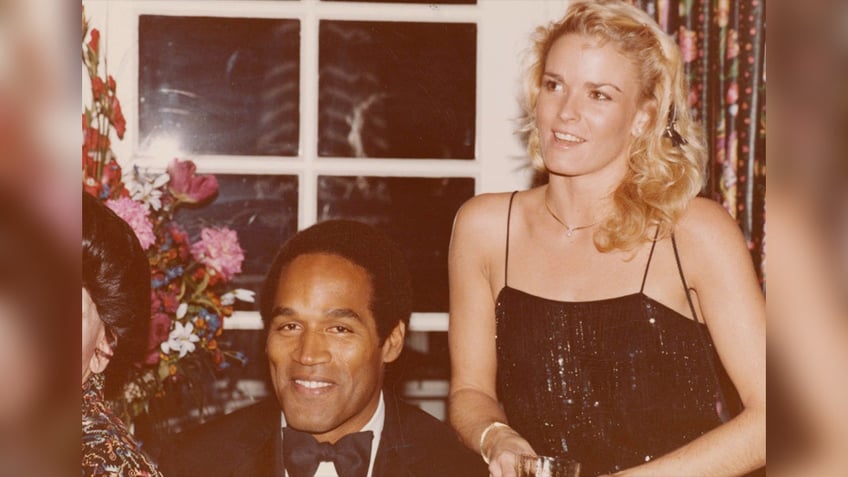 OJ Simpson and Nicole Brown Simpson smiling