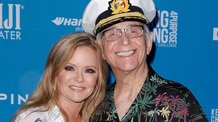 Jill Whelan hugging a smiling Gavin MacLeod