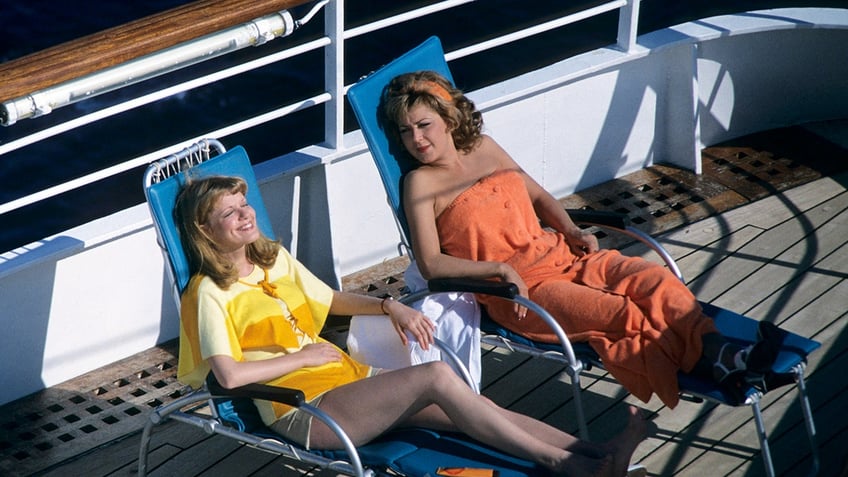 The cast of The Love Boat sunbathing.