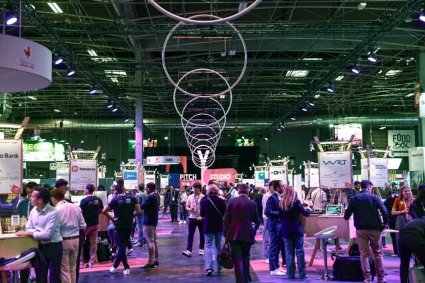 Visitors browse through the stands at the VivaTech technology fair at the Paris Expo Porte