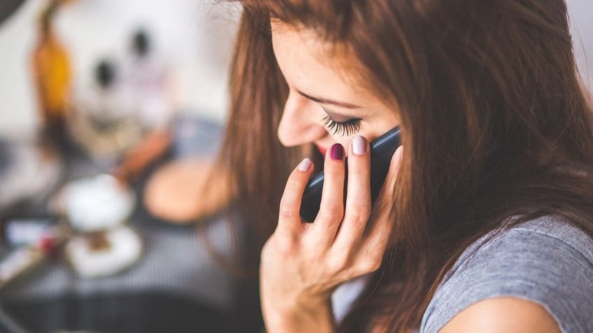 woman speaking on phone 