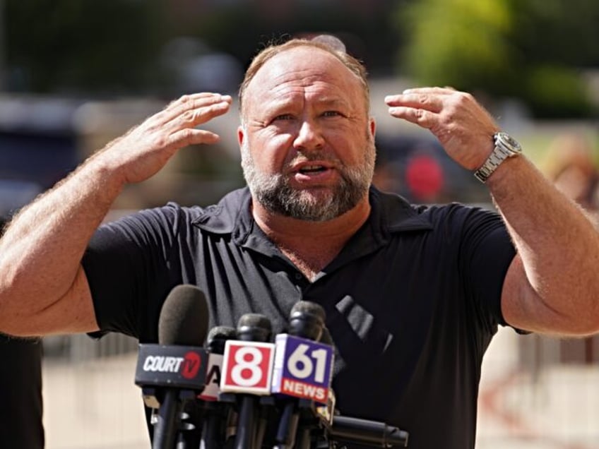 WATERBURY, CONNECTICUT - SEPTEMBER 21: InfoWars founder Alex Jones speaks to the media out