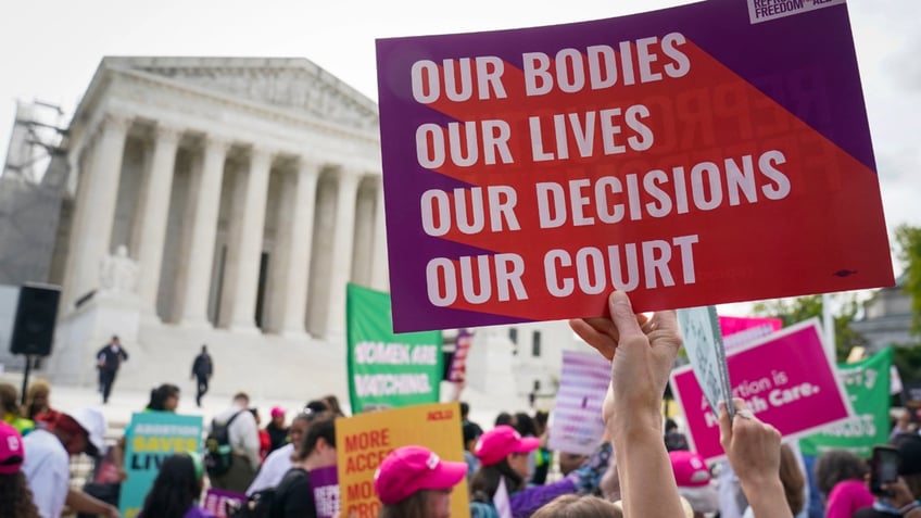 Protestors rally outside the Supreme Court building as justices hear oral arguments in Washington, DC. Justices will hear oral arguments Wednesday in United States v. Skrmetti, a case centered on transgender medical care for minors under the Equal Protection Clause. (Jack Gruber/USA TODAY)