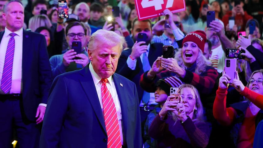 Donald Trump arrives to attend a rally the day before he is scheduled to be inaugurated