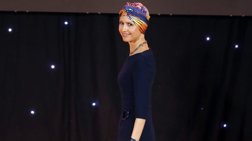 Asma Al Assad wearing a headscarf as she was treated for breast cancer