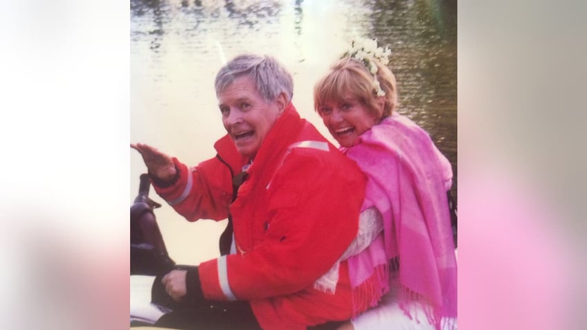 Husband and wife on a jet ski