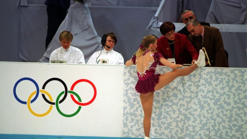 Tonya Harding with boot on judge's stand showing broken shoelace