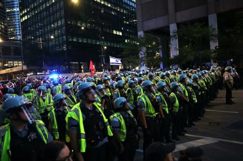 the torch has been passed protests escalate as obamas rinos take the stage on dnc day 2