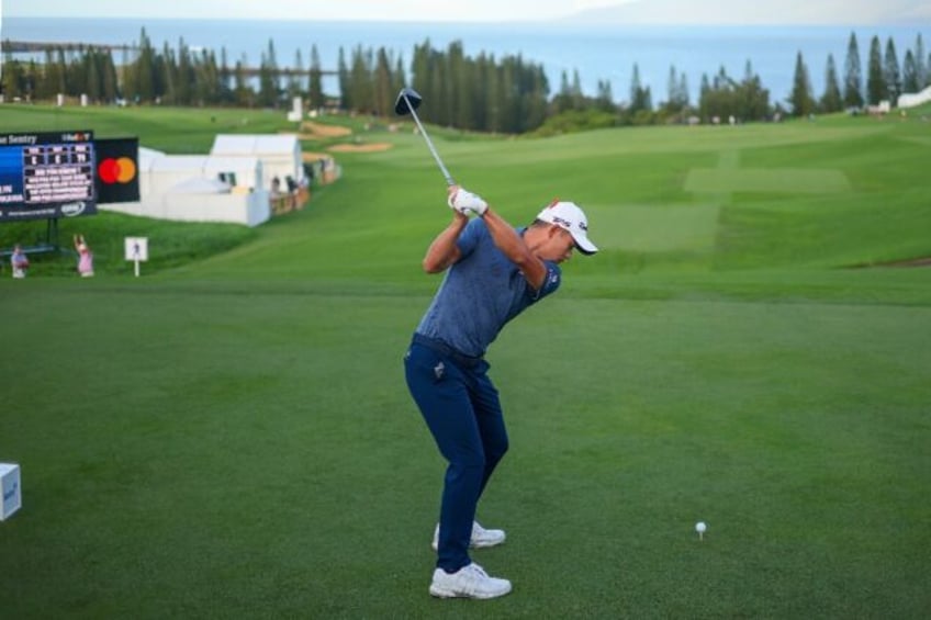 American Collin Morikawa of the United States plays his shot from the first tee in the first round of the PGA Tour Sentry tournament in Hawaii