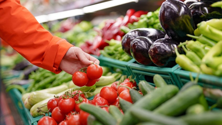 Man shopping for vegetables at the grocery store