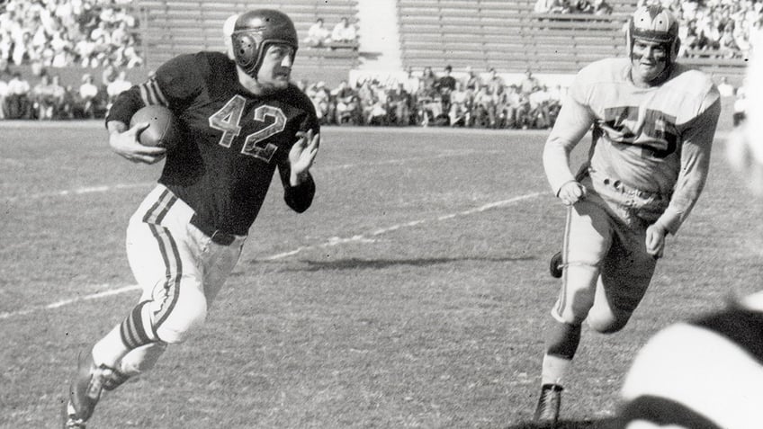 Sid Luckman running with football