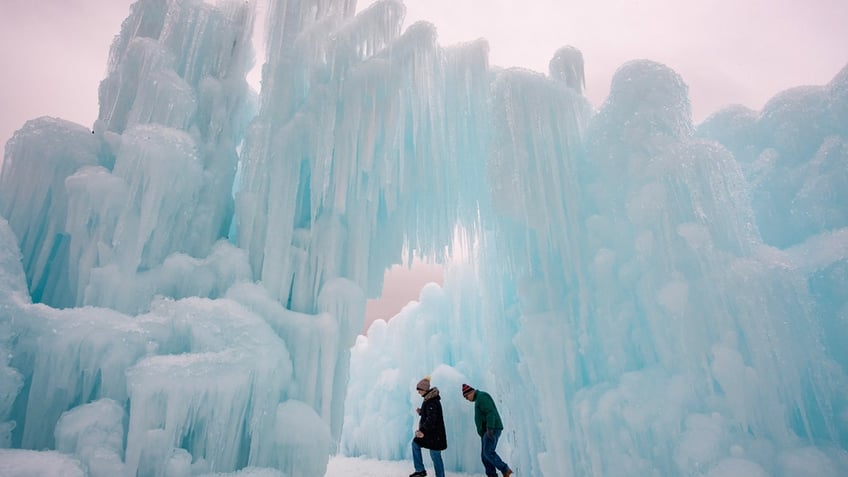 People walking in New Hampshire ice castles