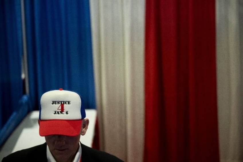 A man at a Republican event in Maryland on February 22, 2024, wears a cap to show support