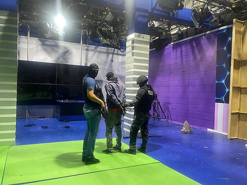 Police officers arrest one of the unidentified gunmen who burst into a studio of the state-owned TC television while live, in Guayaquil, Ecuador, on January 9, 2024, a day after Ecuadorean President Daniel Noboa declared a state of emergency following the escape from prison of a dangerous narco boss. Gunshots …