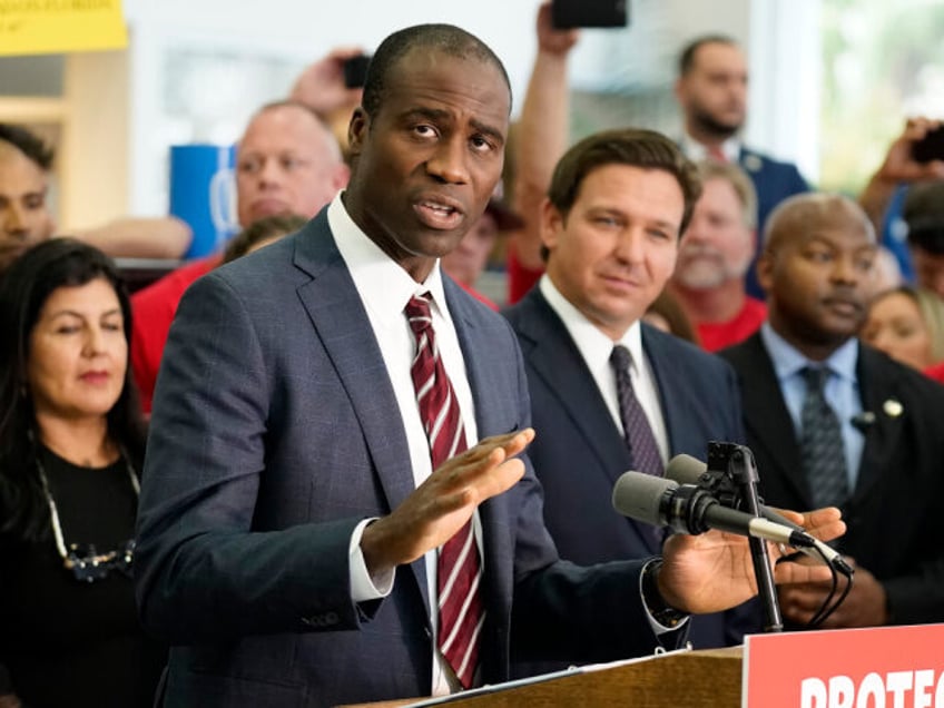 FILE - Florida Surgeon General Dr. Joseph Ladapo gestures as speaks to supporters and memb