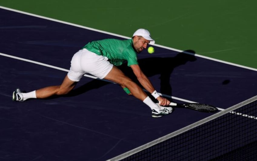 Serbia's Novak Djokovic stretches for a backhand in his shock second-round loss to Botic v