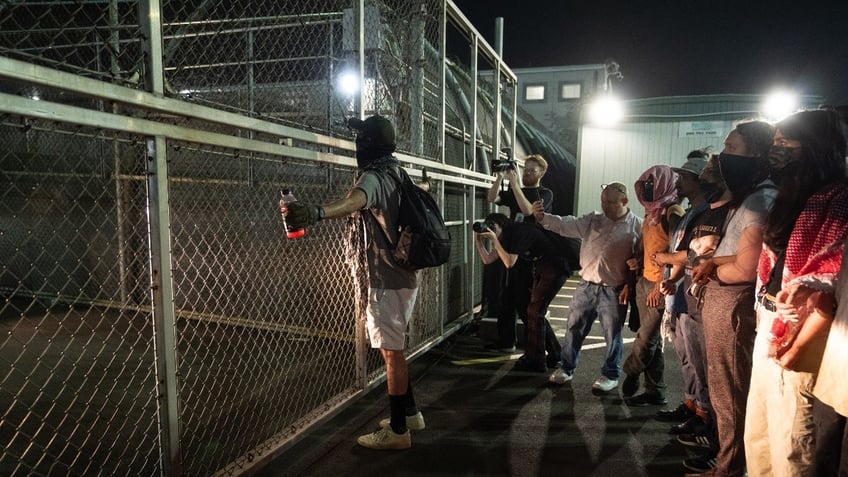 Protesters block vehicles from entering or leaving the Delaney Hall ICE facility following the reported escape of four migrants in Newark, United States, on June 12, 2025. 