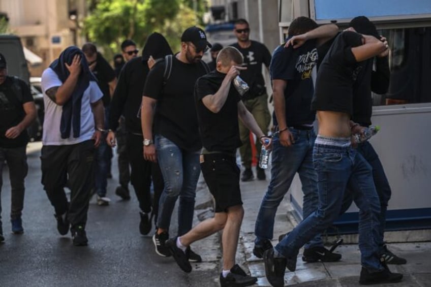 thirty five more people charged after fatal stabbing of greek football fan