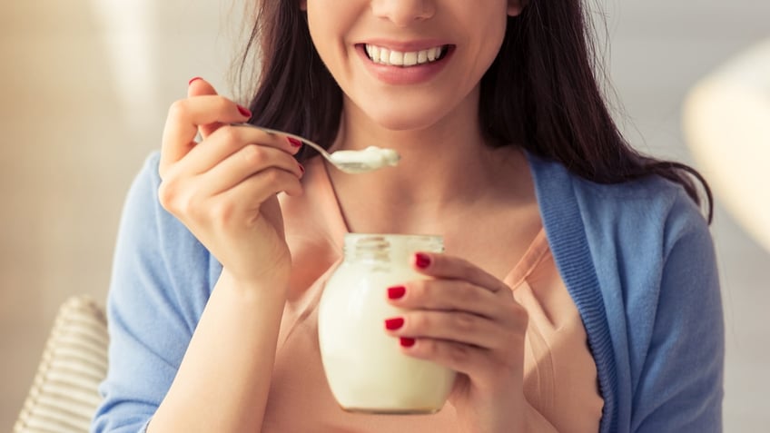 Girl eating yogurt