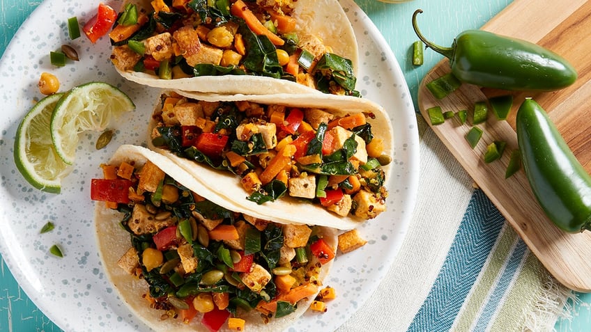tofu breakfast wraps seen on plate with limes