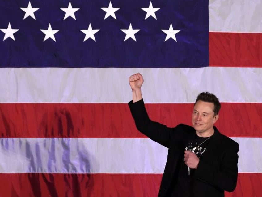 Elon Musk in front of a flag