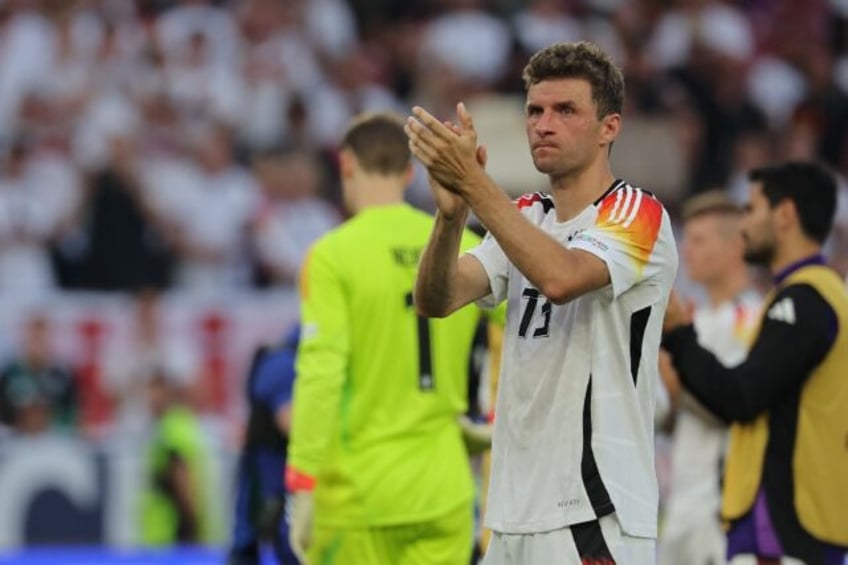 Thomas Mueller applauds fans after Germany lost to Spain in Stuttgart at Euro 2024