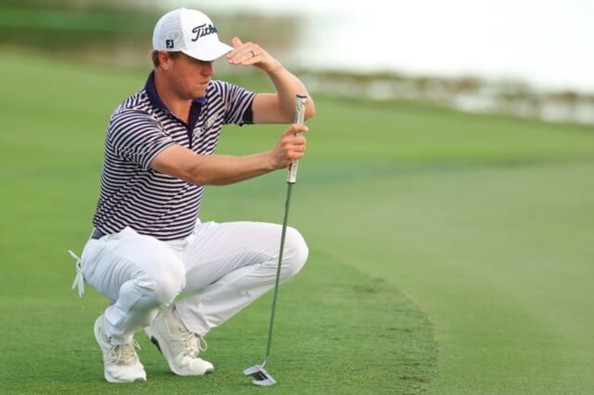 American Justin Thomas lines up a putt on the way to the third-round lead in the Hero Worl