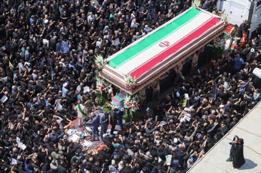 Mourners attend the funeral of Iran's president Ebrahim Raisi in Tehran
