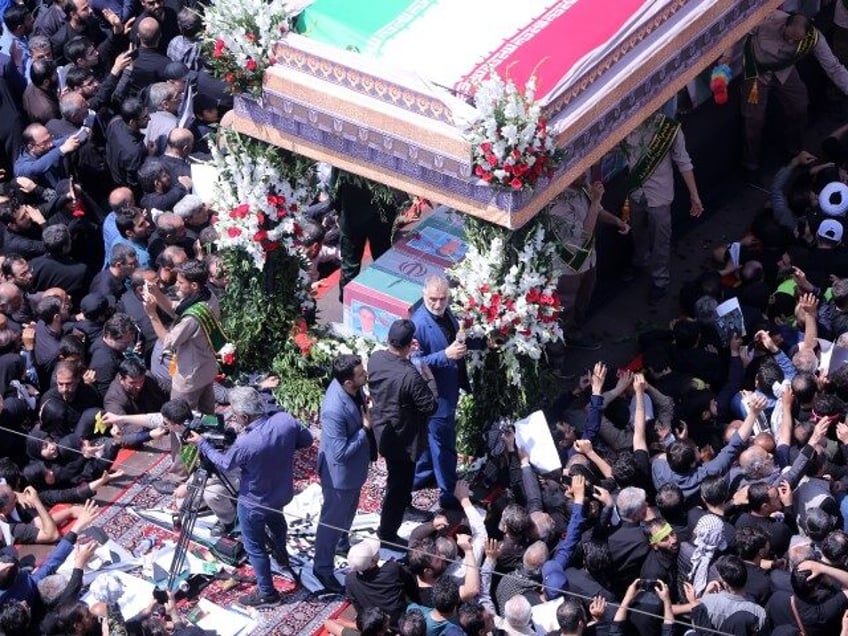 Hundreds of thousands of people gather in Revolution Square (Enghelab Square) and surround